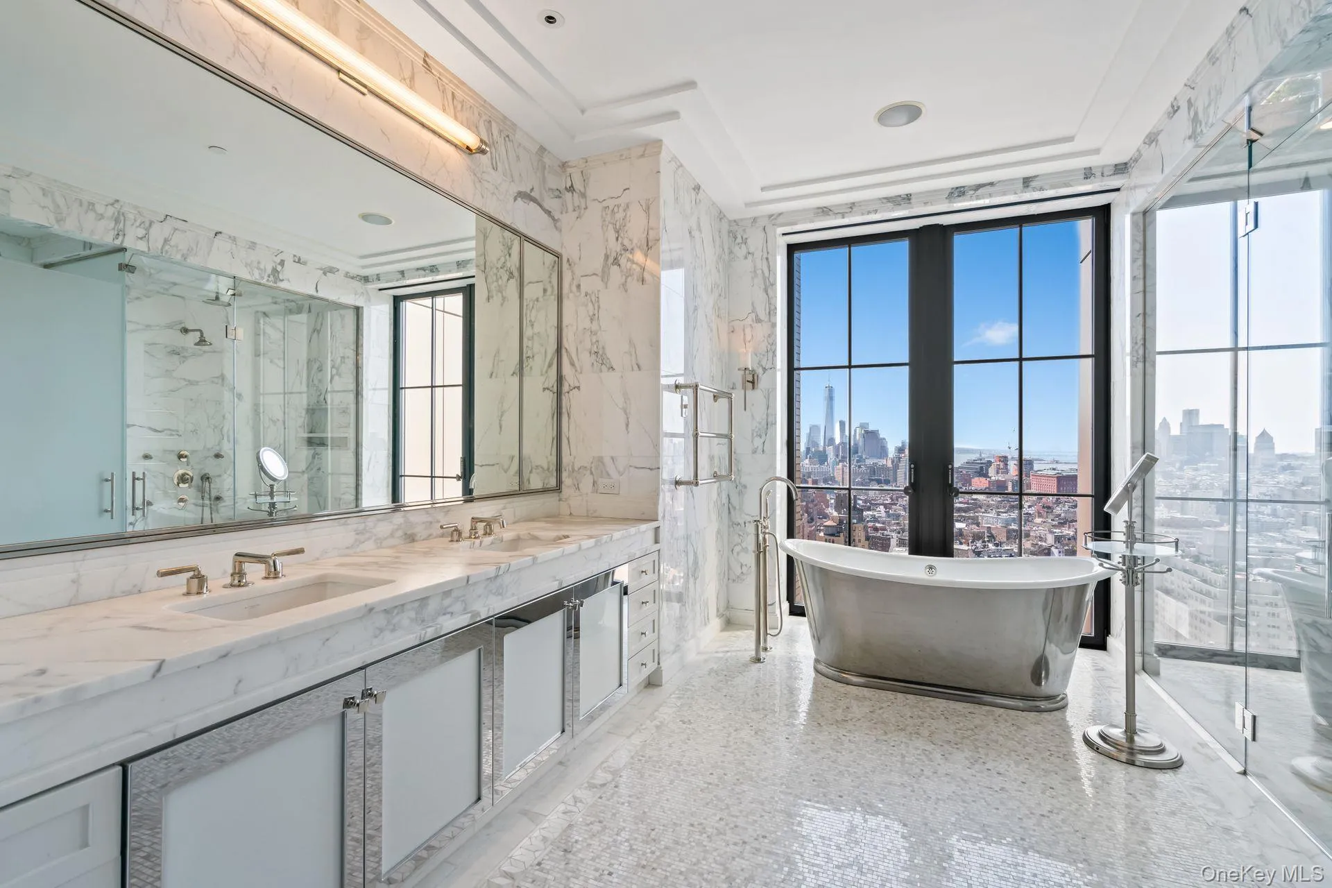 Full bath featuring a sink, a marble finish shower, and a view of city Full bath featuring a sink, a marble finish shower, and a view of city