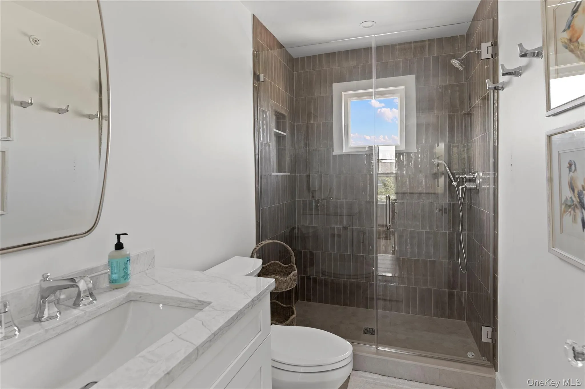 Full bathroom featuring toilet, a stall shower, and vanity Full bathroom featuring toilet, a stall shower, and vanity