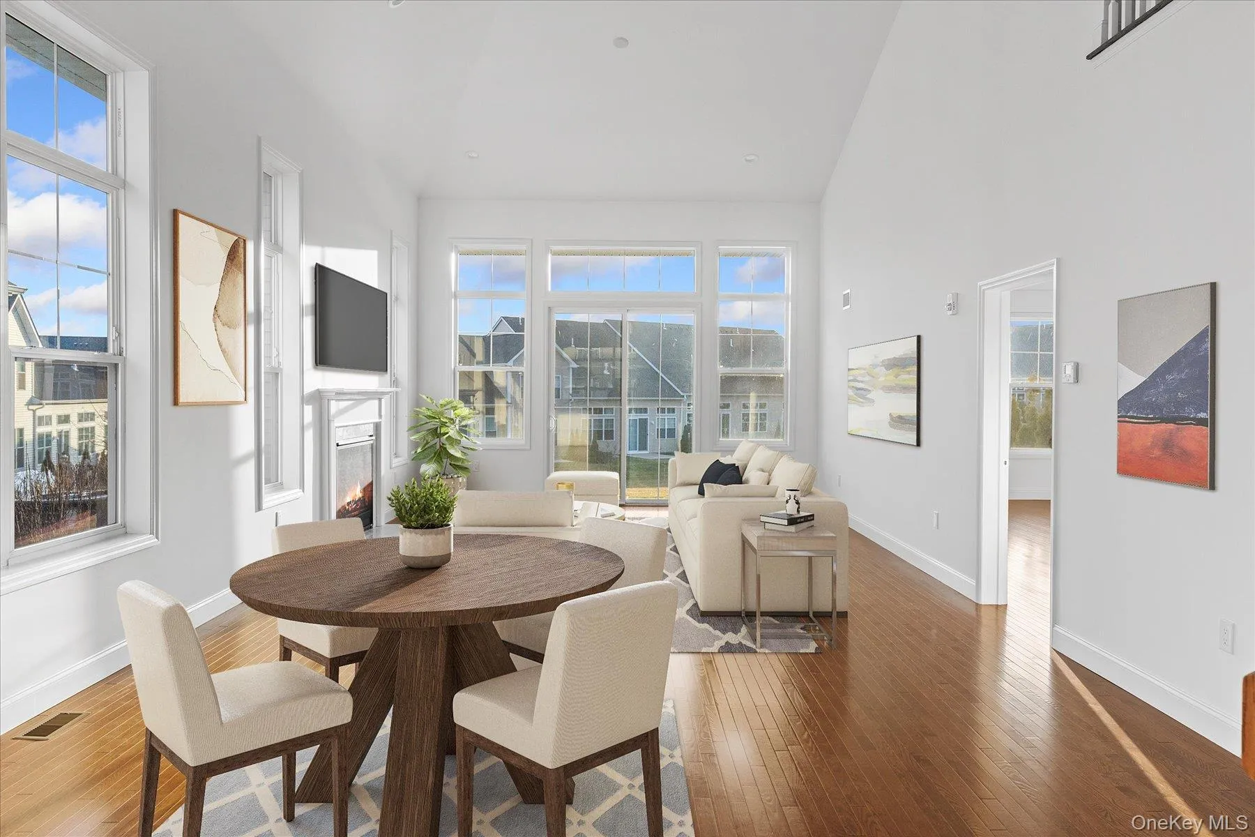 (Virtually staged) Living/dining room, soaring ceilings, gas fireplace (Virtually staged) Living/dining room, soaring ceilings, gas fireplace