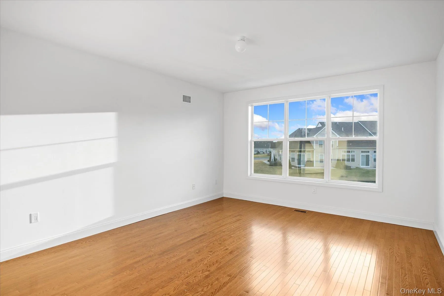 Primary bedroom with hardwood floors Primary bedroom with hardwood floors