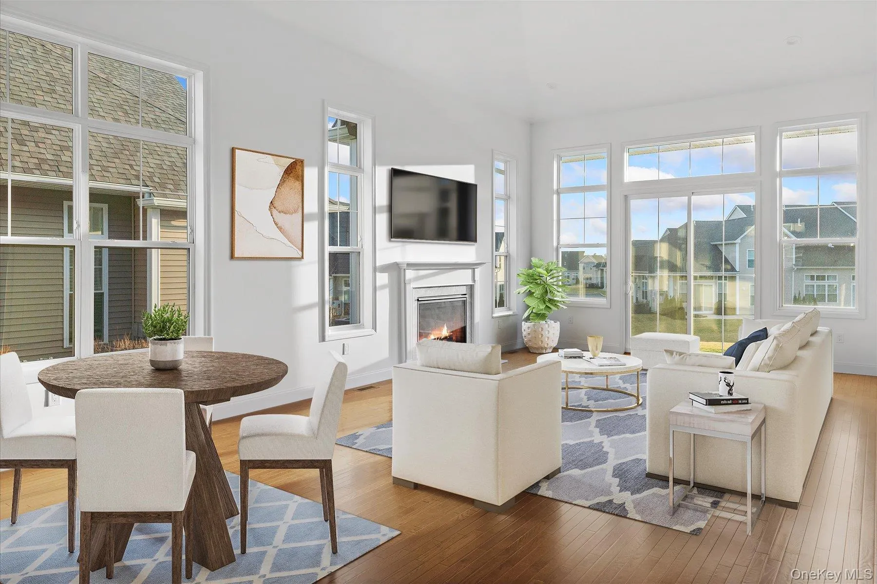 (Virtually staged) Living room featuring wood flooring and plenty of natural light (Virtually staged) Living room featuring wood flooring and plenty of natural light