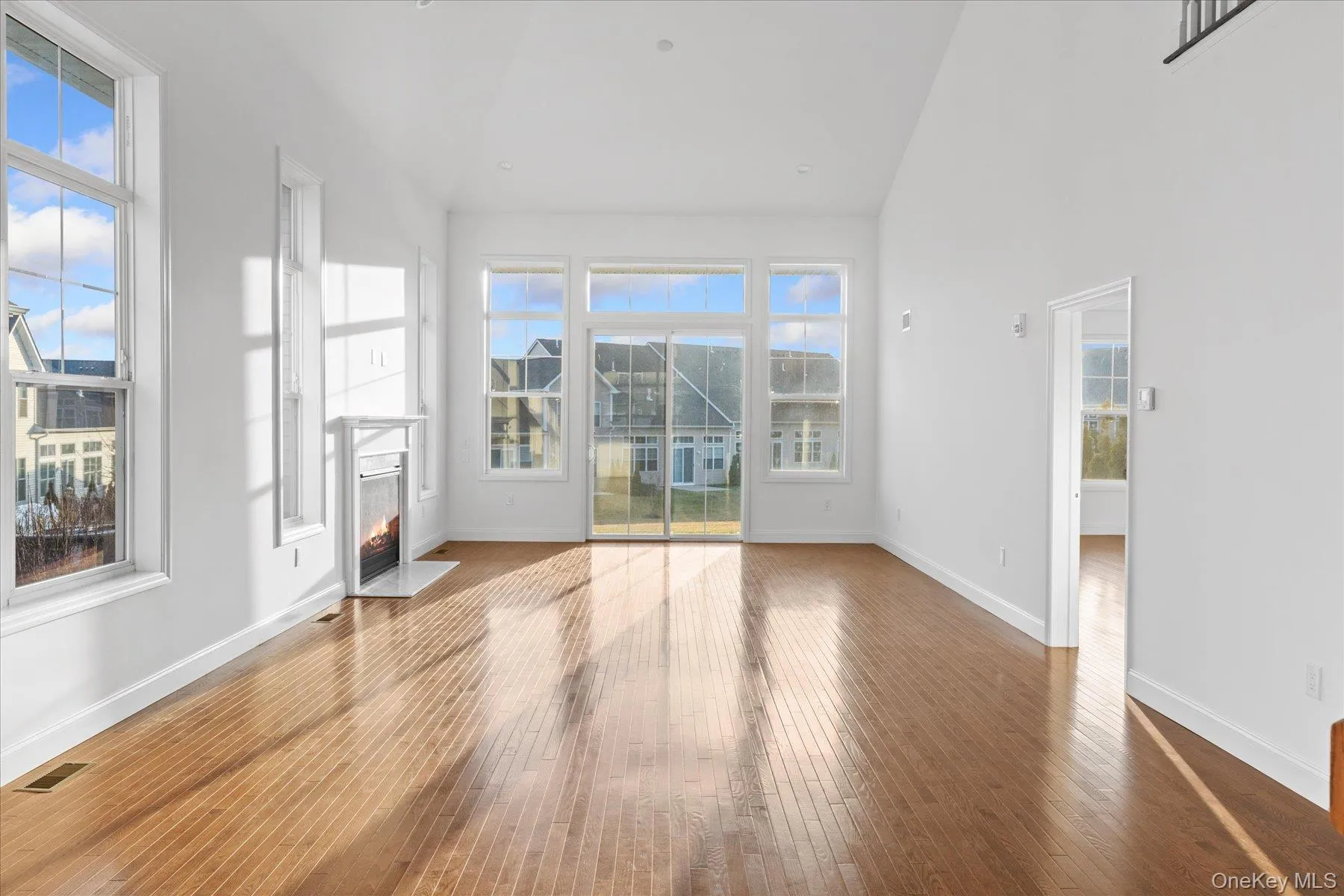 Living/dining room with beautiful hardwood floors Living/dining room with beautiful hardwood floors