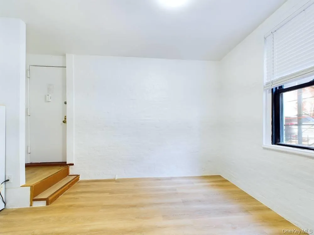 Empty room featuring hardwood / wood-style flooring Empty room featuring hardwood / wood-style flooring