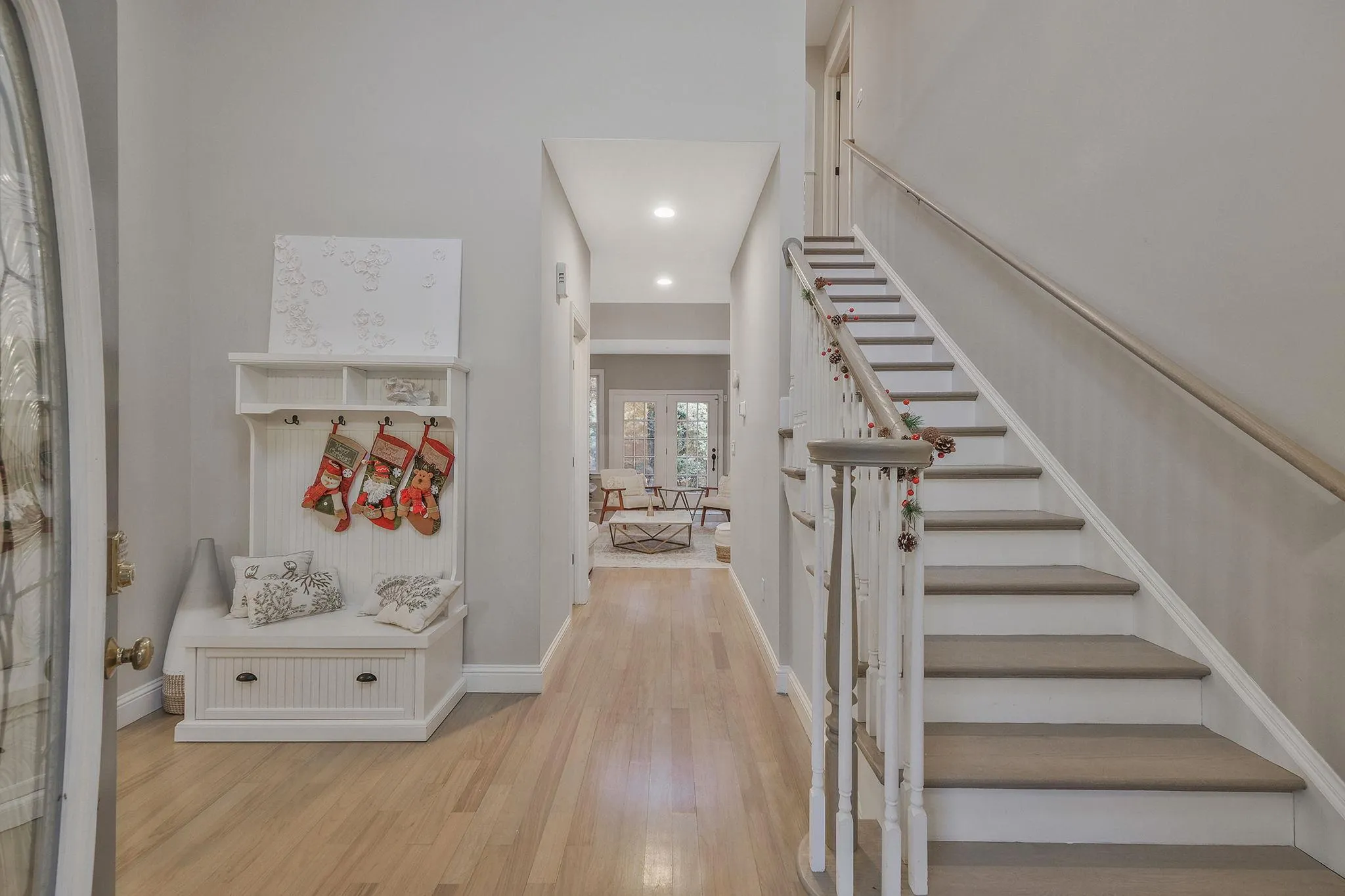 Foyer featuring french doors and light hardwood / wood-style floors Foyer featuring french doors and light hardwood / wood-style floors