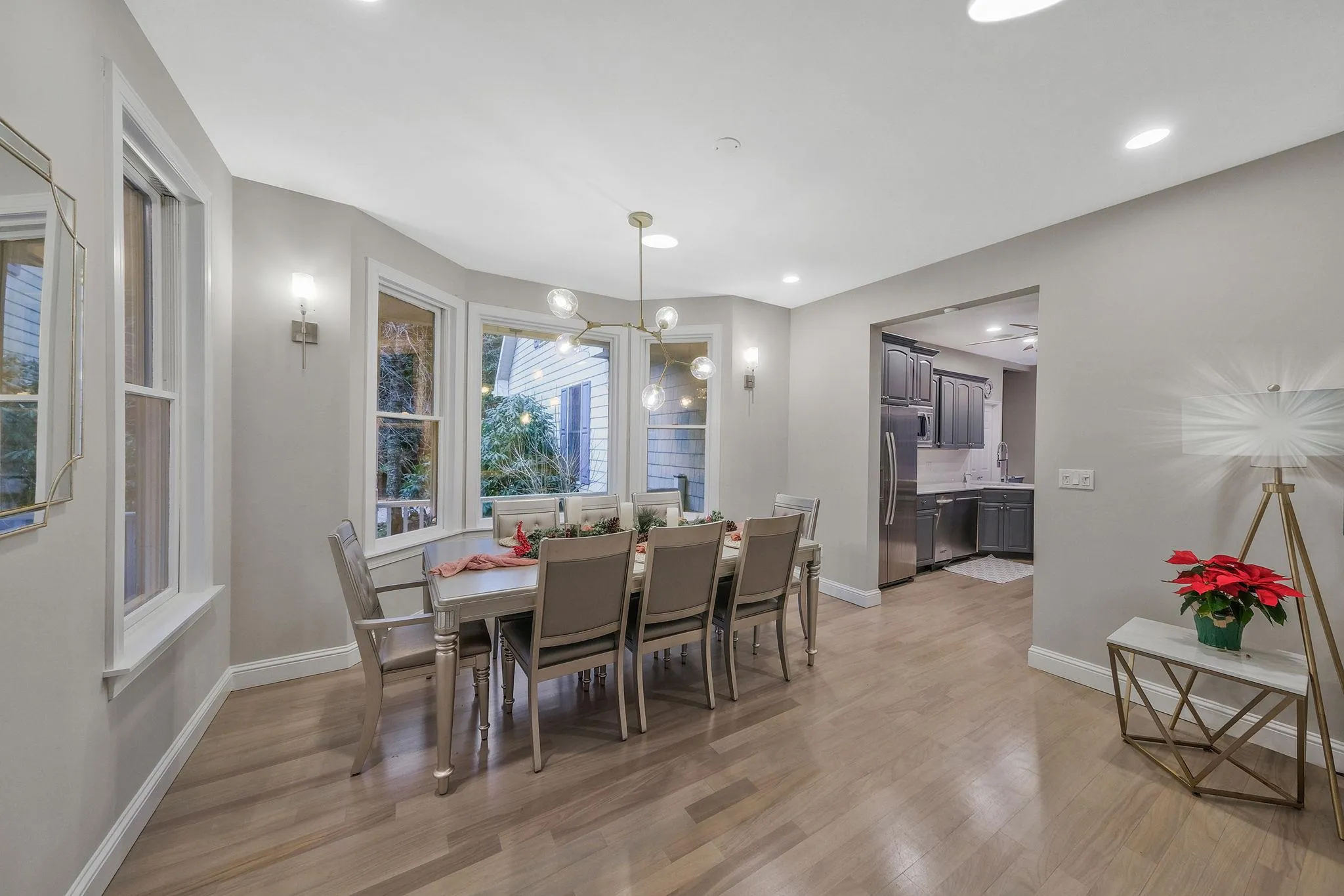 Dining room with light wood-type flooring and sink Dining room with light wood-type flooring and sink