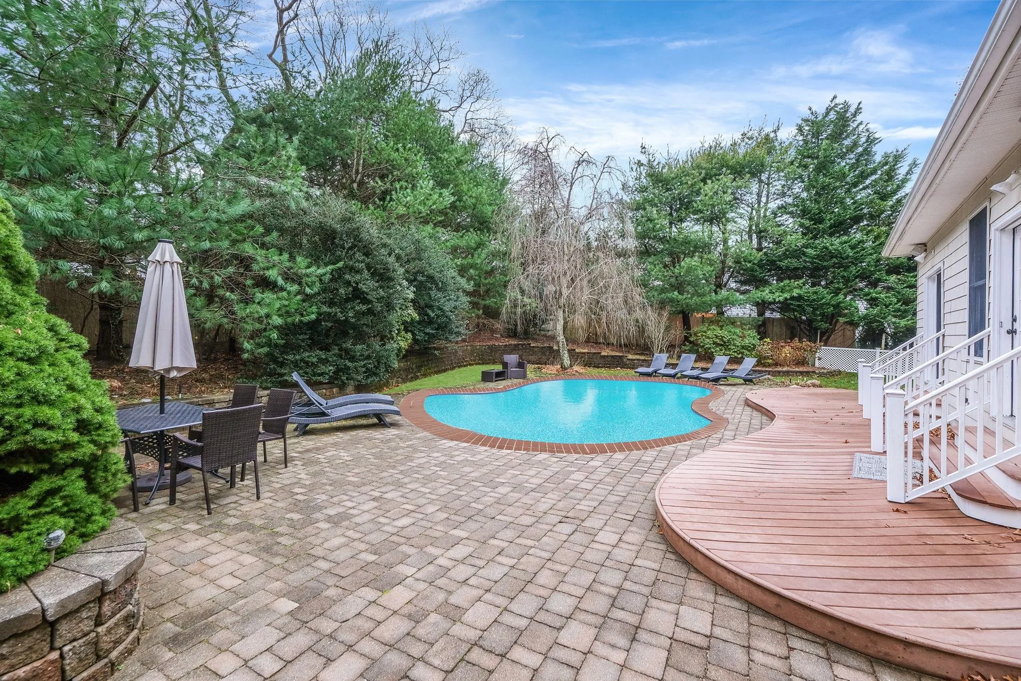 View of pool featuring a patio area View of pool featuring a patio area