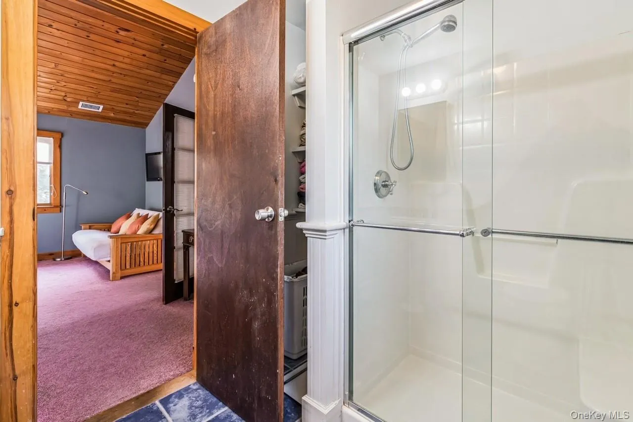 En-Suite Primary Bathroom featuring walk in shower