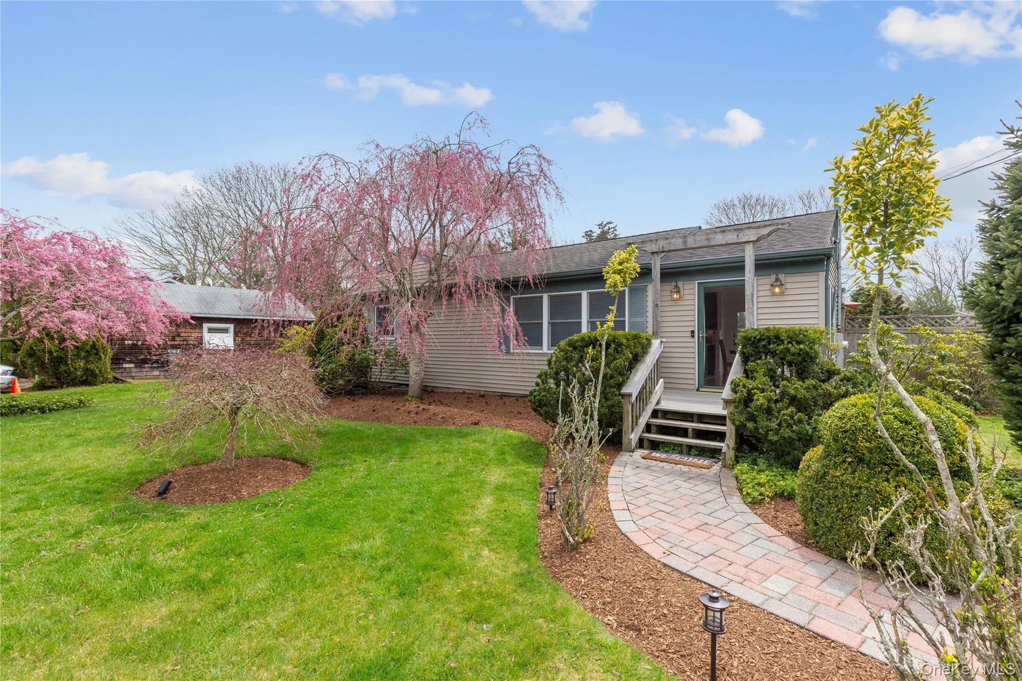 Single story home featuring a front yard Single story home featuring a front yard
