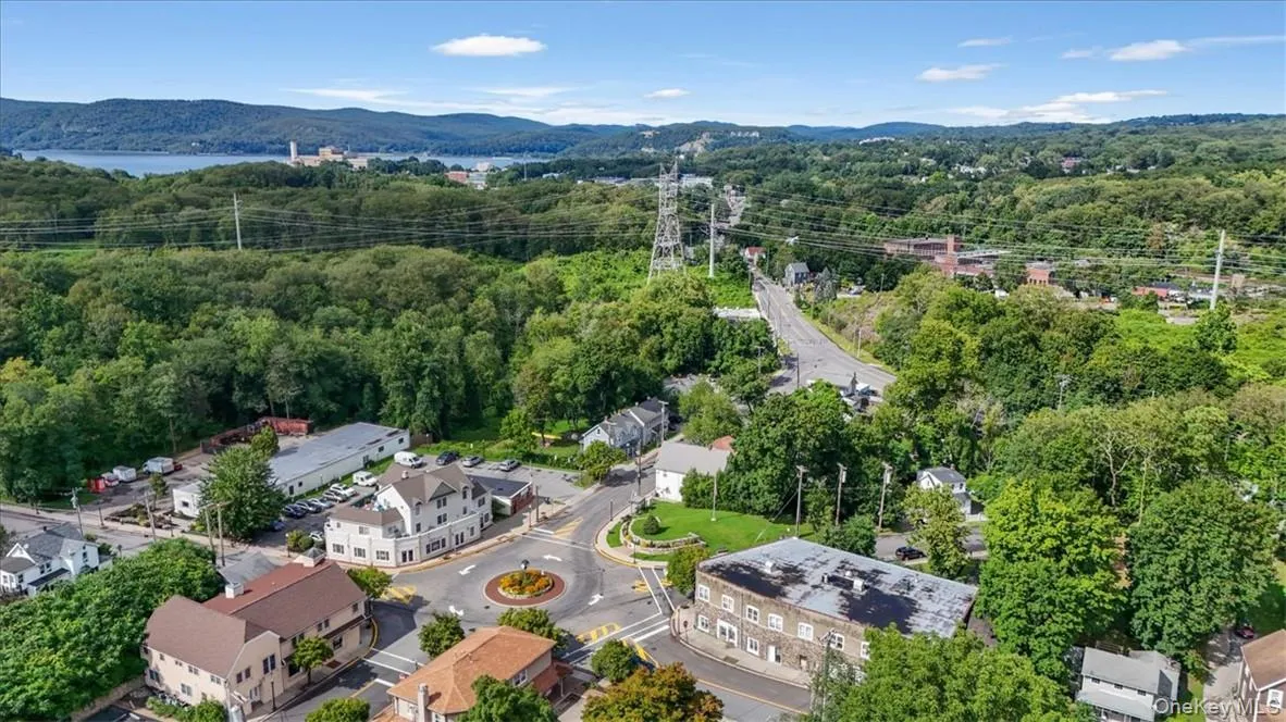 Birds eye view of property with a mountain view Birds eye view of property with a mountain view