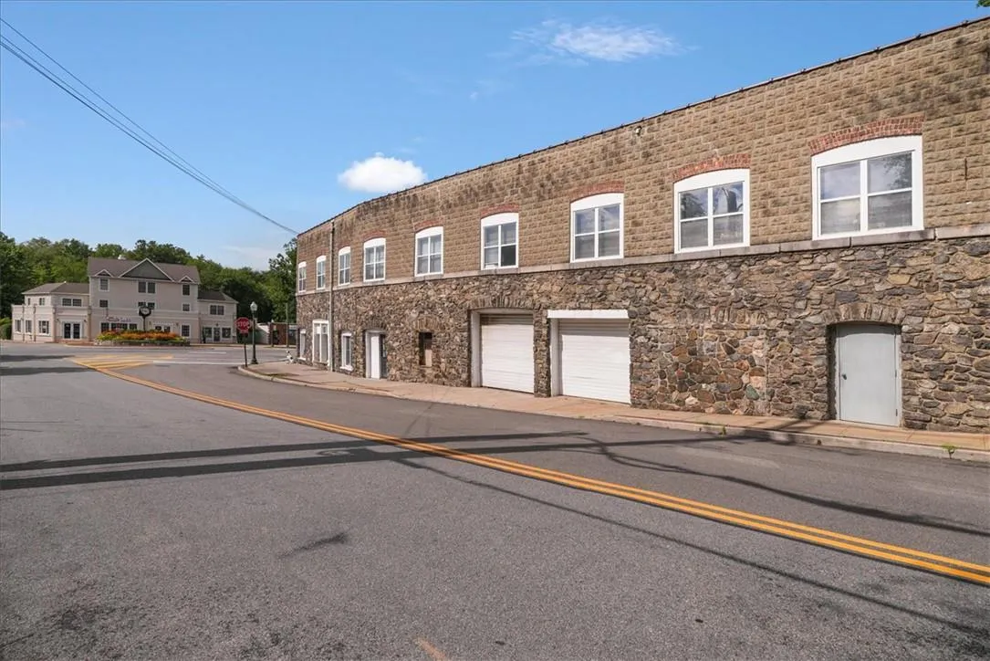 View of property featuring a garage View of property featuring a garage