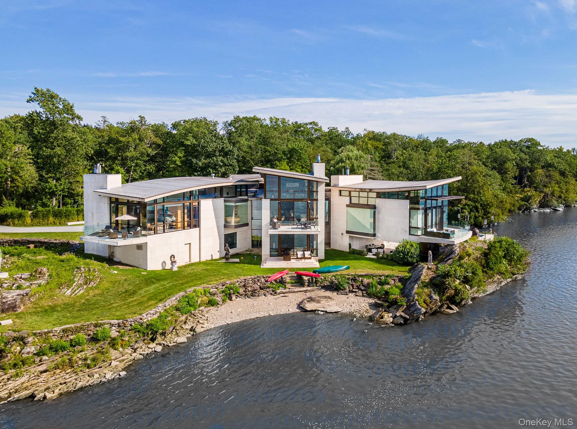 Rear view of house featuring a water view Rear view of house featuring a water view