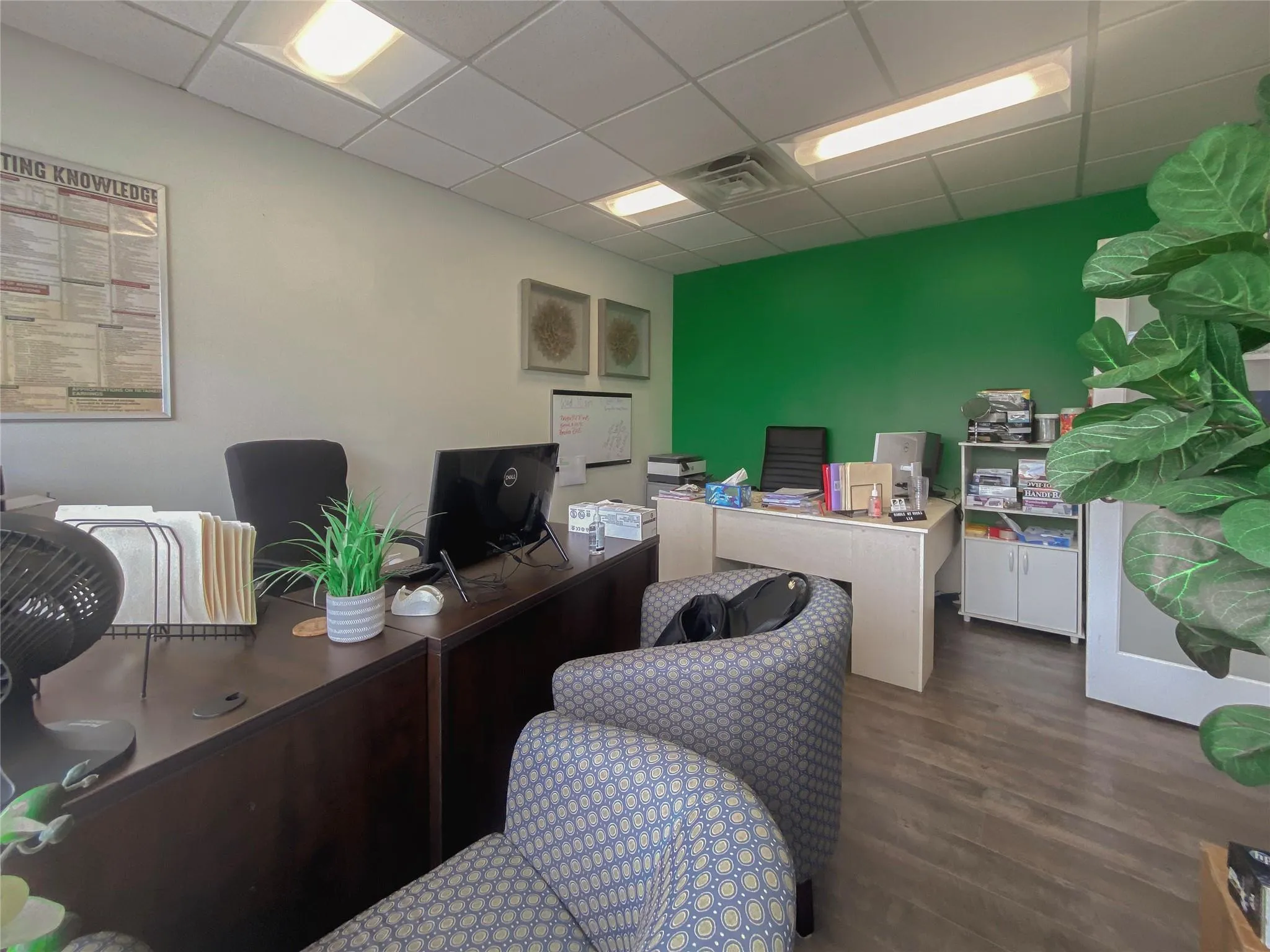 Home office with dark hardwood / wood-style floors and a drop ceiling Home office with dark hardwood / wood-style floors and a drop ceiling