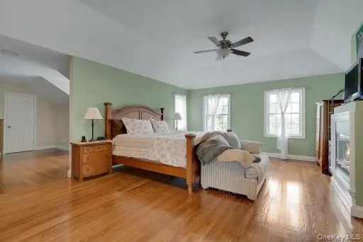 Primary Bedroom featuring light hardwood flooring and ceiling fan Primary Bedroom featuring light hardwood flooring and ceiling fan