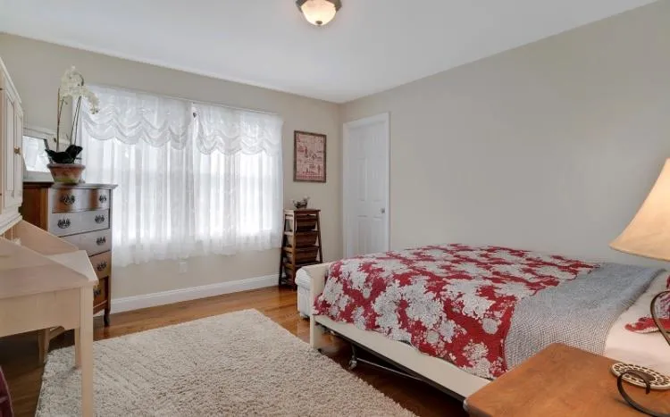Bedroom featuring hardwood floors Bedroom featuring hardwood floors