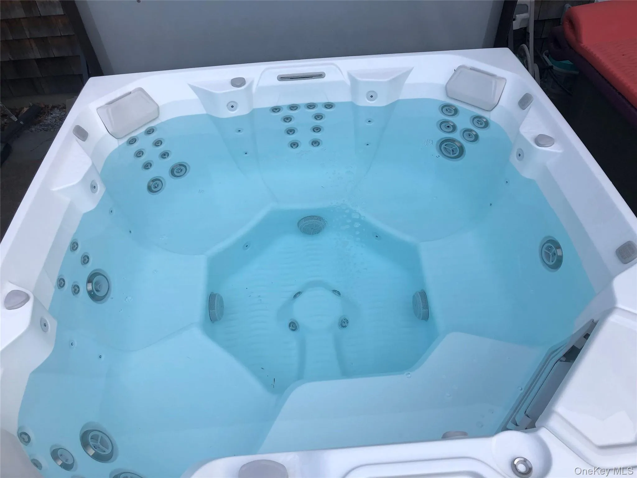 Exterior details featuring a jacuzzi Exterior details featuring a jacuzzi