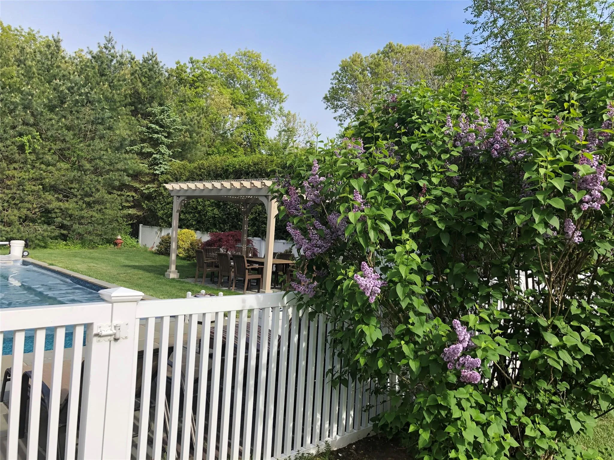 View of yard with a pergola and a swimming pool View of yard with a pergola and a swimming pool