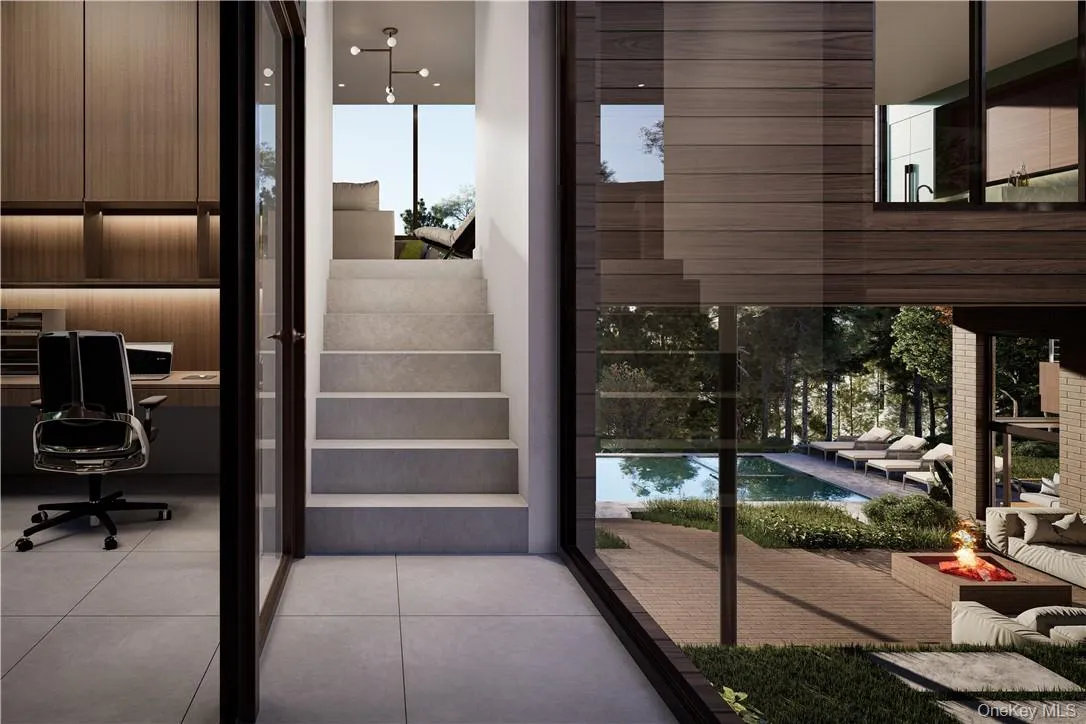 Entry to main living level with access to mezzanine level private office. Entry to main living level with access to mezzanine level private office.