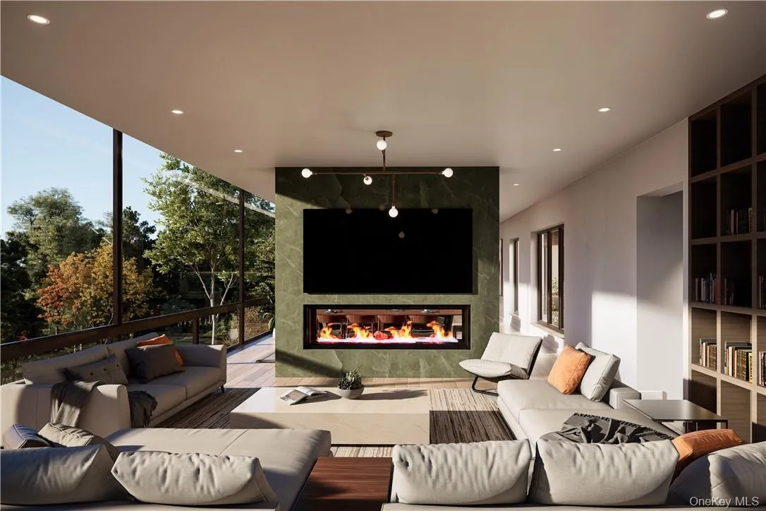 The living room features a fireplace, stunning views and an abundance of natural light. The living room features a fireplace, stunning views and an abundance of natural light.