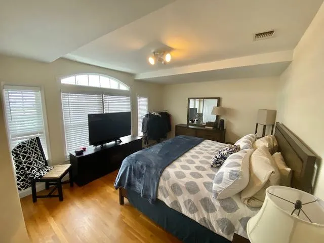 Bedroom featuring light hardwood / wood-style floors Bedroom featuring light hardwood / wood-style floors