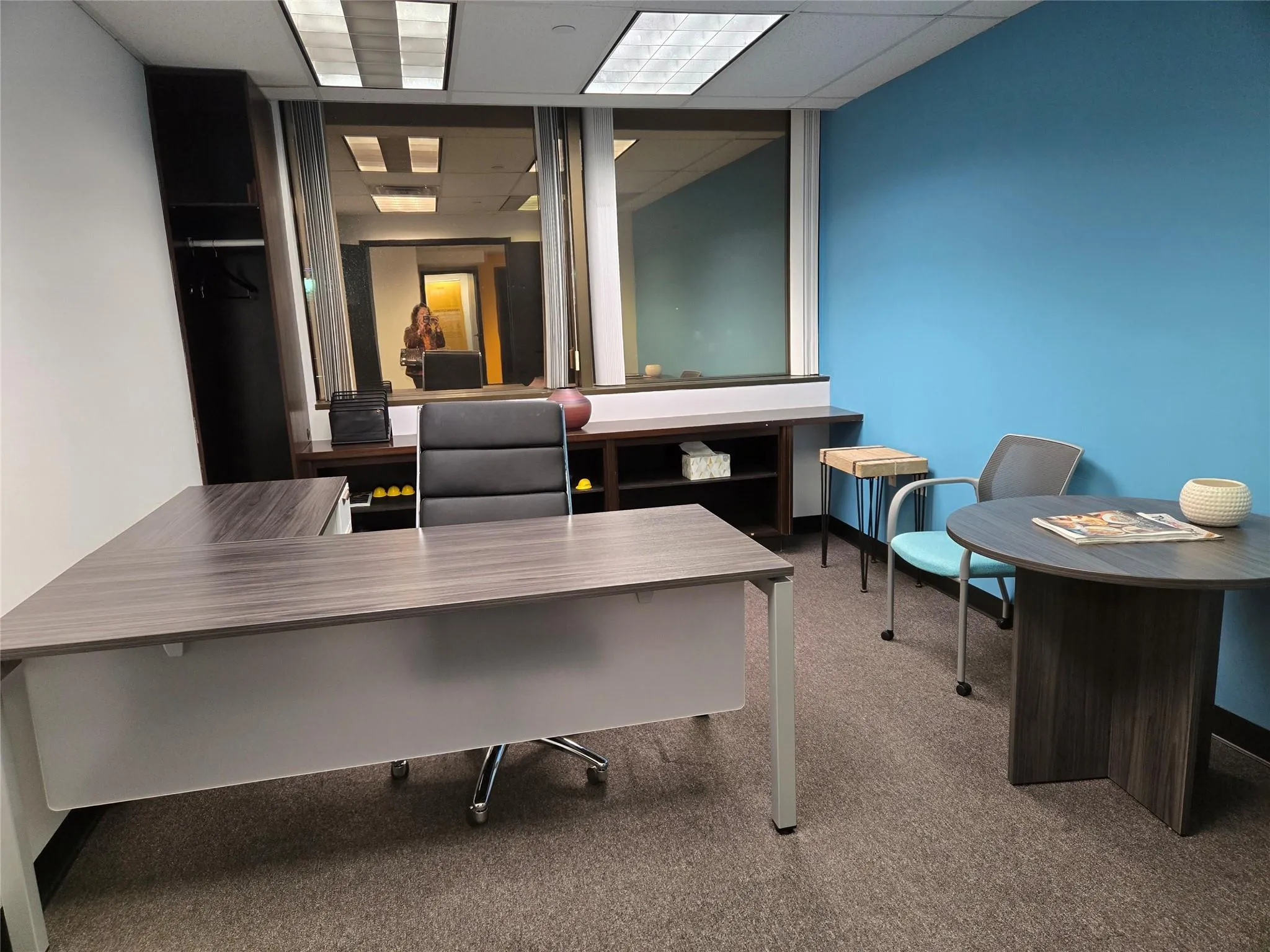 Carpeted office featuring a drop ceiling Carpeted office featuring a drop ceiling