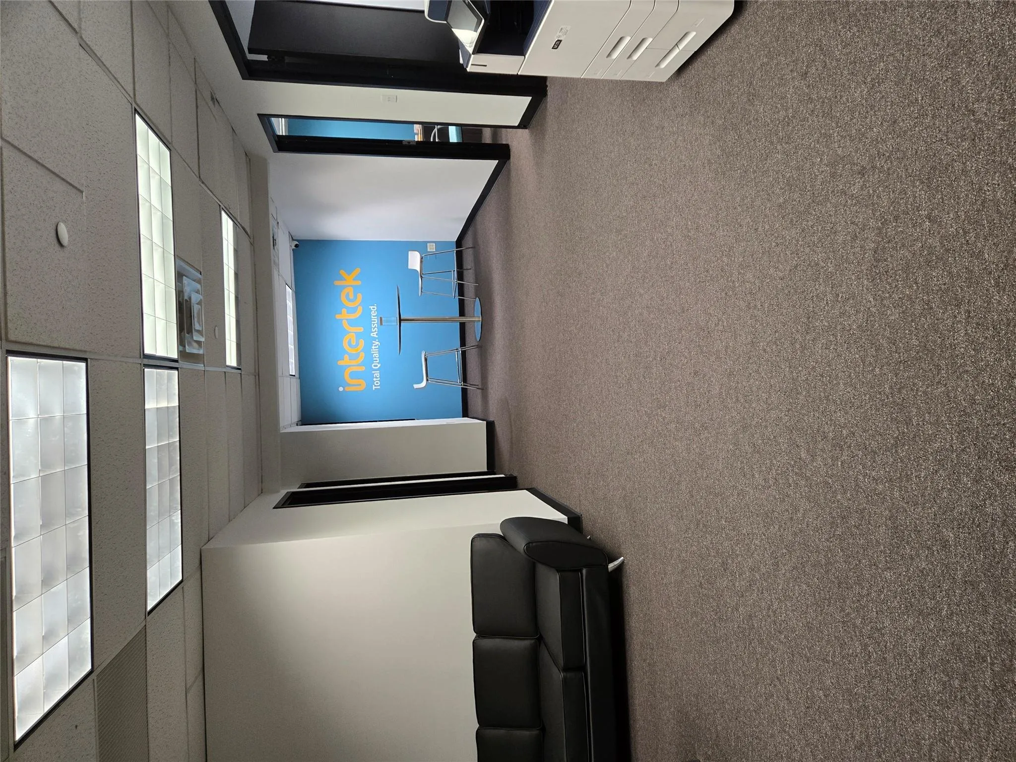 Cinema room featuring carpet flooring and a paneled ceiling Cinema room featuring carpet flooring and a paneled ceiling