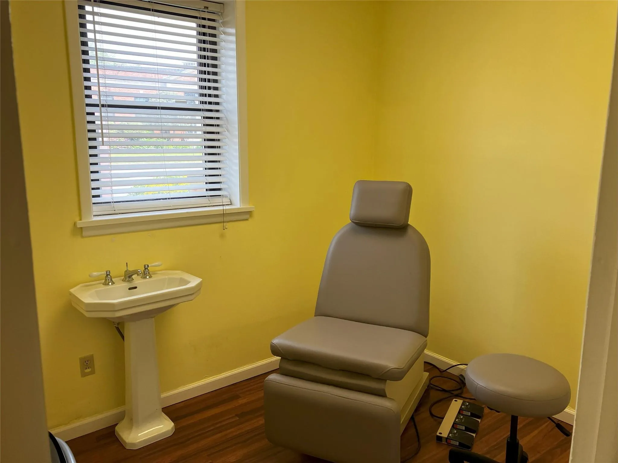 Living area featuring dark hardwood / wood-style flooring and sink Living area featuring dark hardwood / wood-style flooring and sink