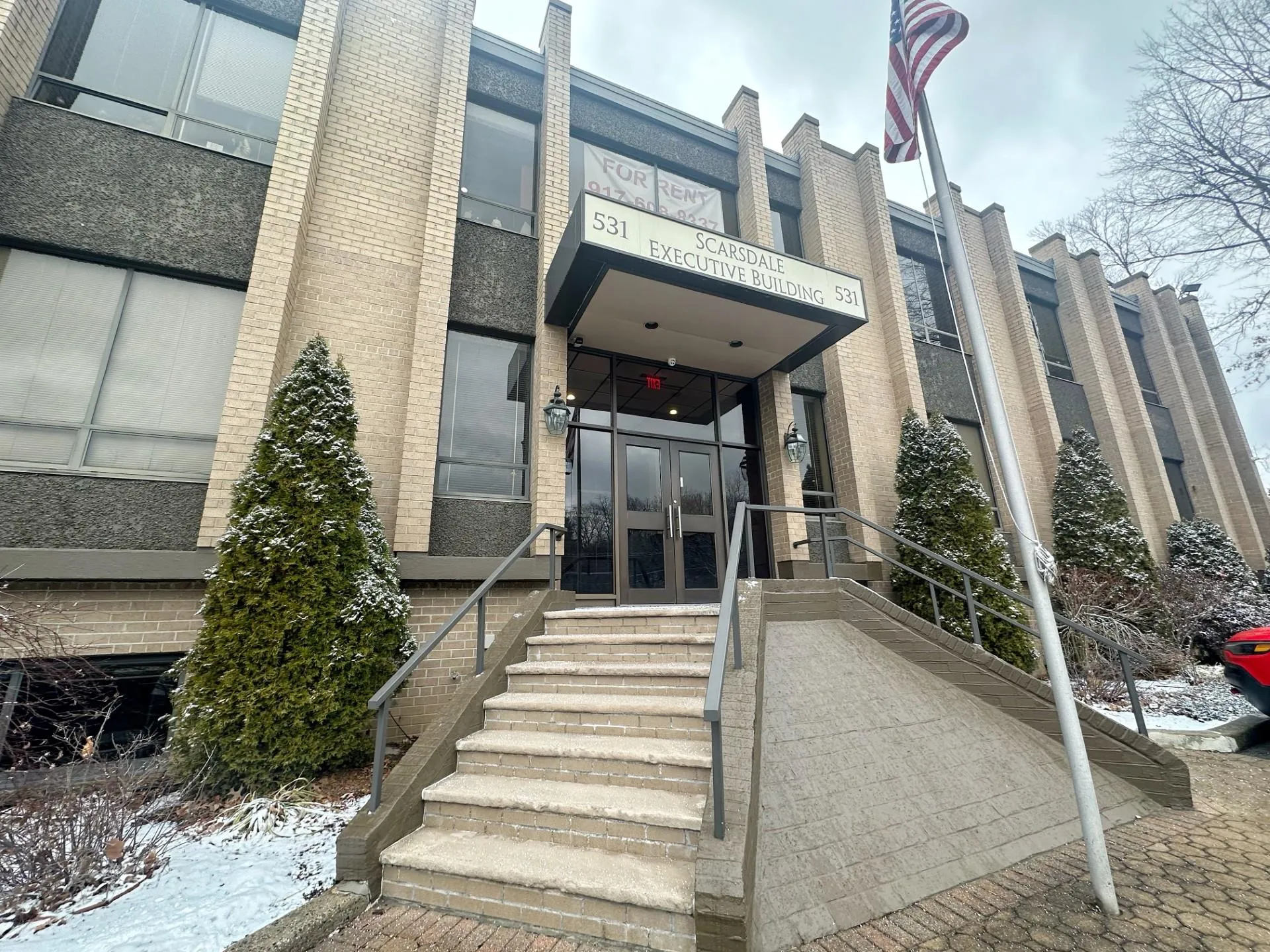 Snow covered property entrance with french doors Snow covered property entrance with french doors