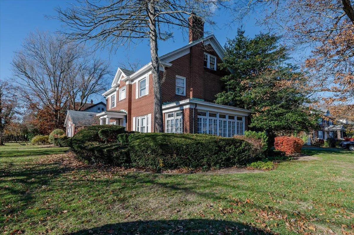 View of side of home with a yard View of side of home with a yard