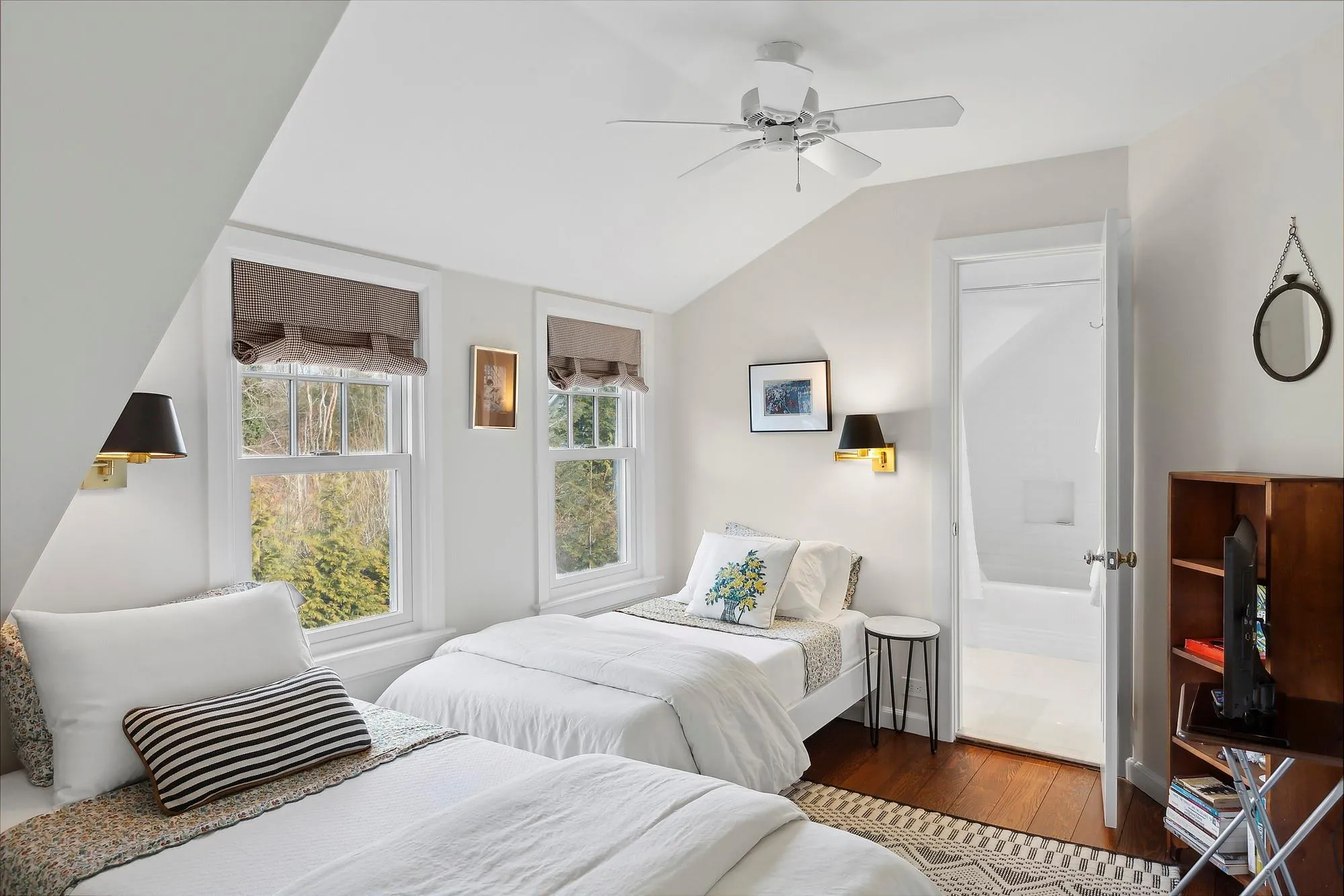 Bedroom with ceiling fan, dark wood-type flooring, connected bathroom, and vaulted ceiling Bedroom with ceiling fan, dark wood-type flooring, connected bathroom, and vaulted ceiling