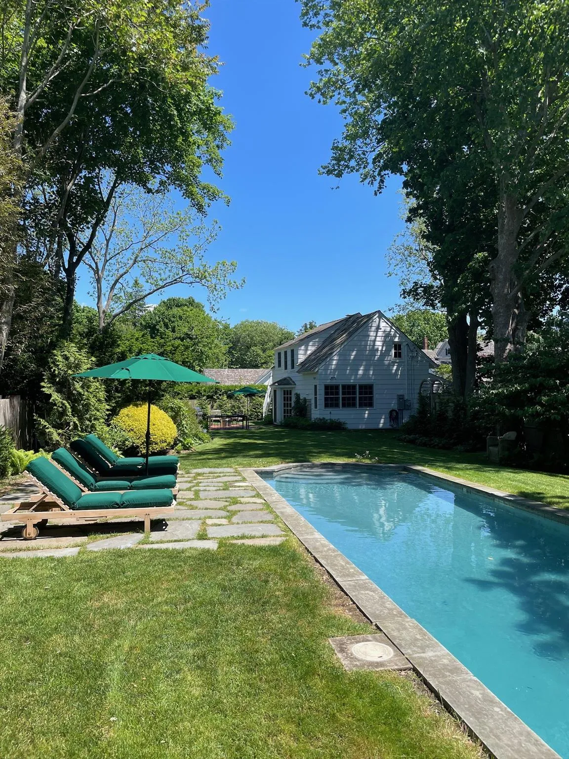 View of swimming pool featuring a yard View of swimming pool featuring a yard