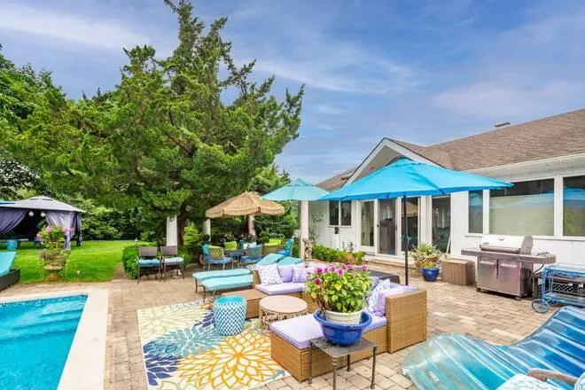 View of patio / terrace featuring an outdoor hangout area and a grill View of patio / terrace featuring an outdoor hangout area and a grill