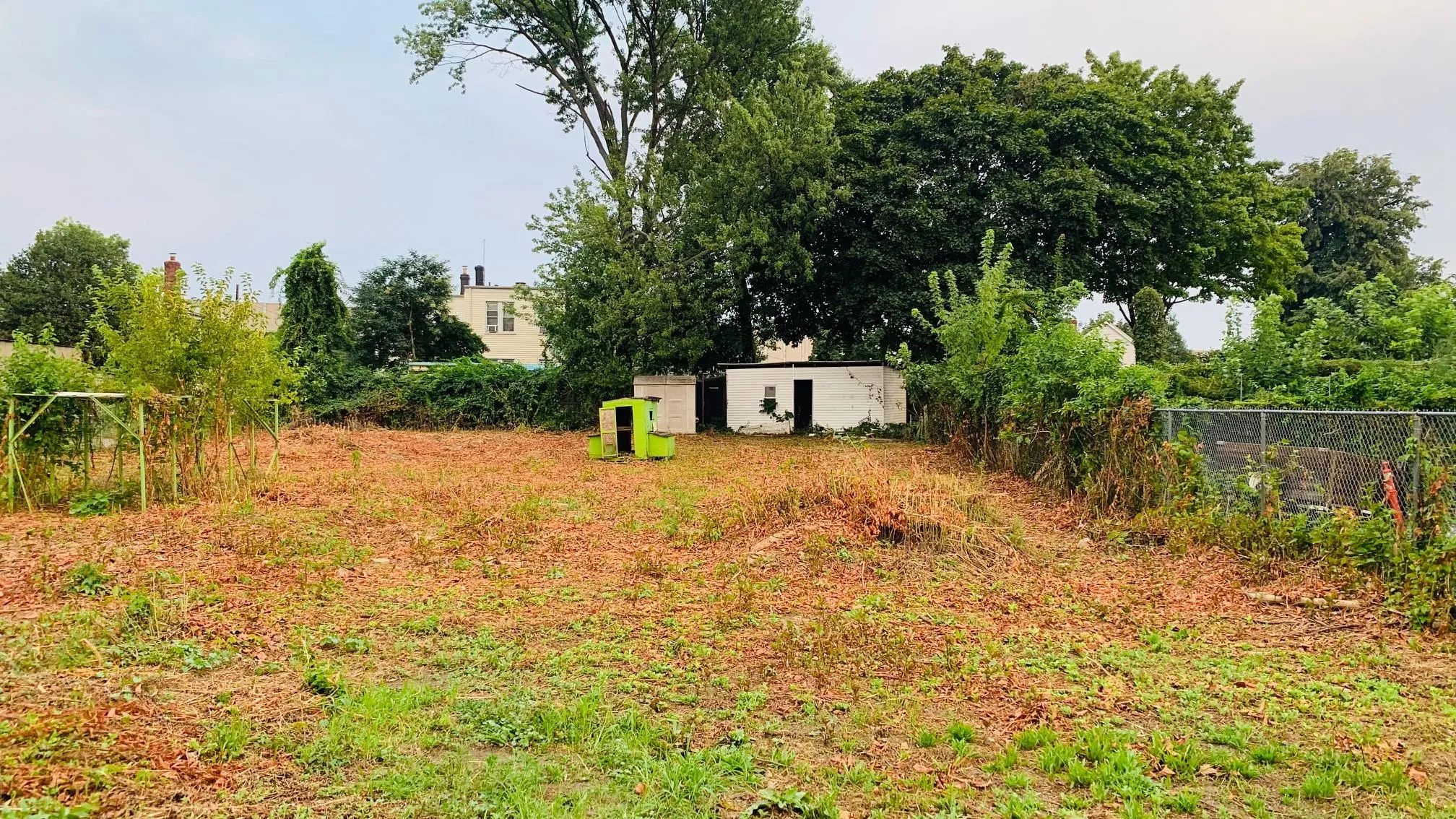 View of yard with fence and an outdoor structure View of yard with fence and an outdoor structure