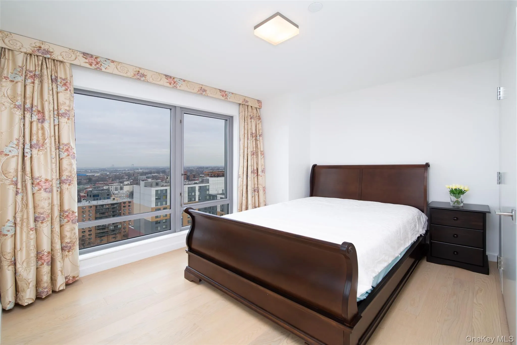 Bedroom featuring light hardwood / wood-style flooring Bedroom featuring light hardwood / wood-style flooring