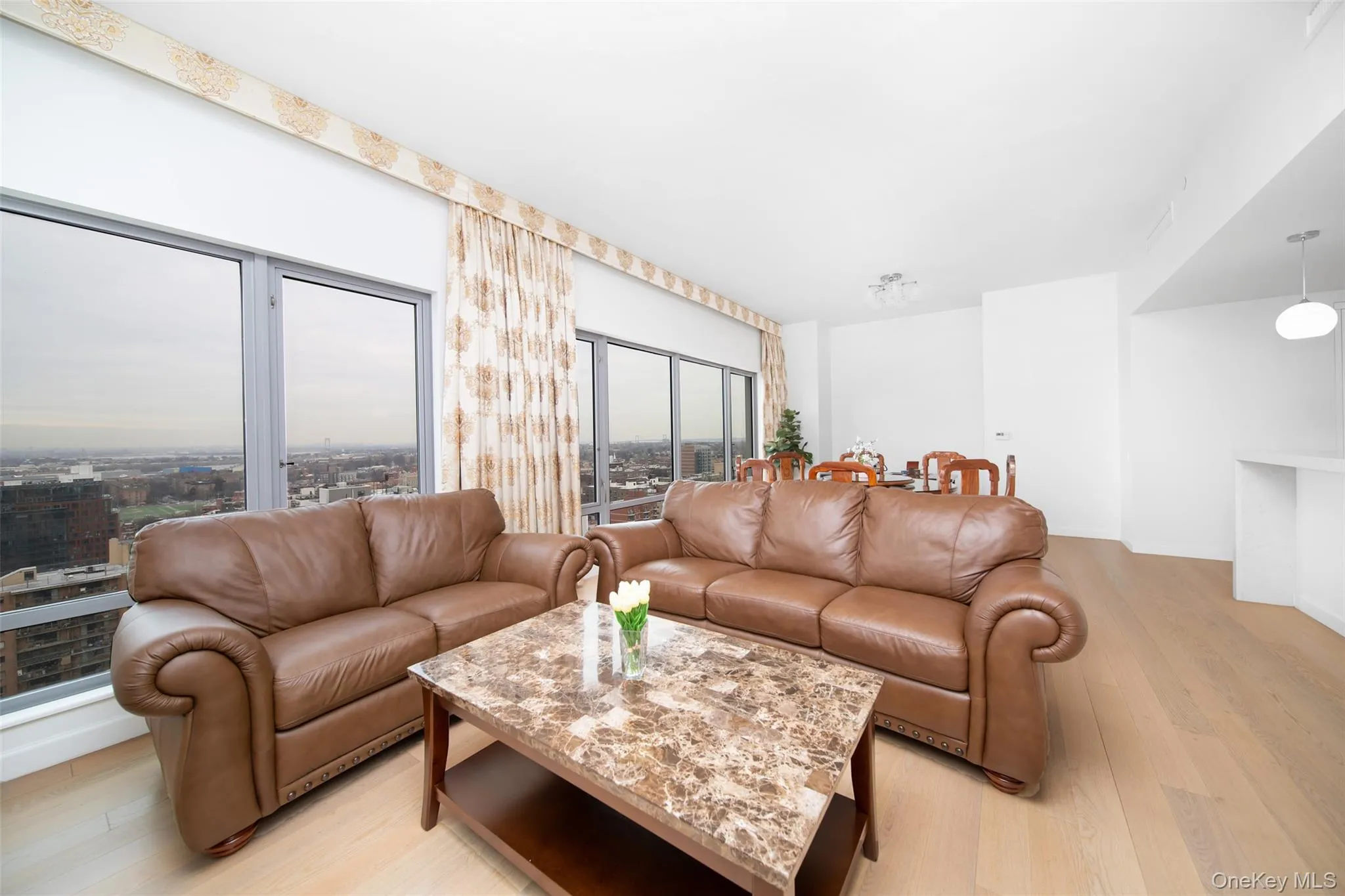 Living room with light hardwood / wood-style flooring Living room with light hardwood / wood-style flooring