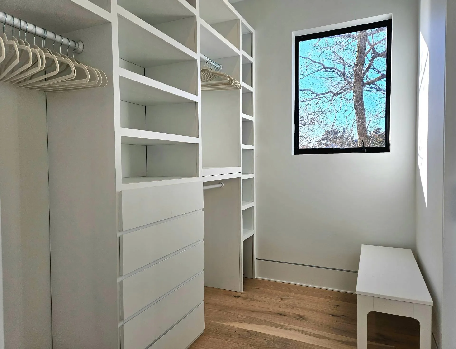 Walk in closet with wood finished floors Walk in closet with wood finished floors