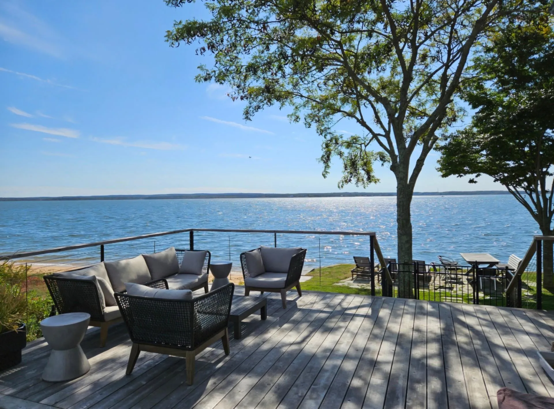 Deck with a water view and an outdoor living space Deck with a water view and an outdoor living space