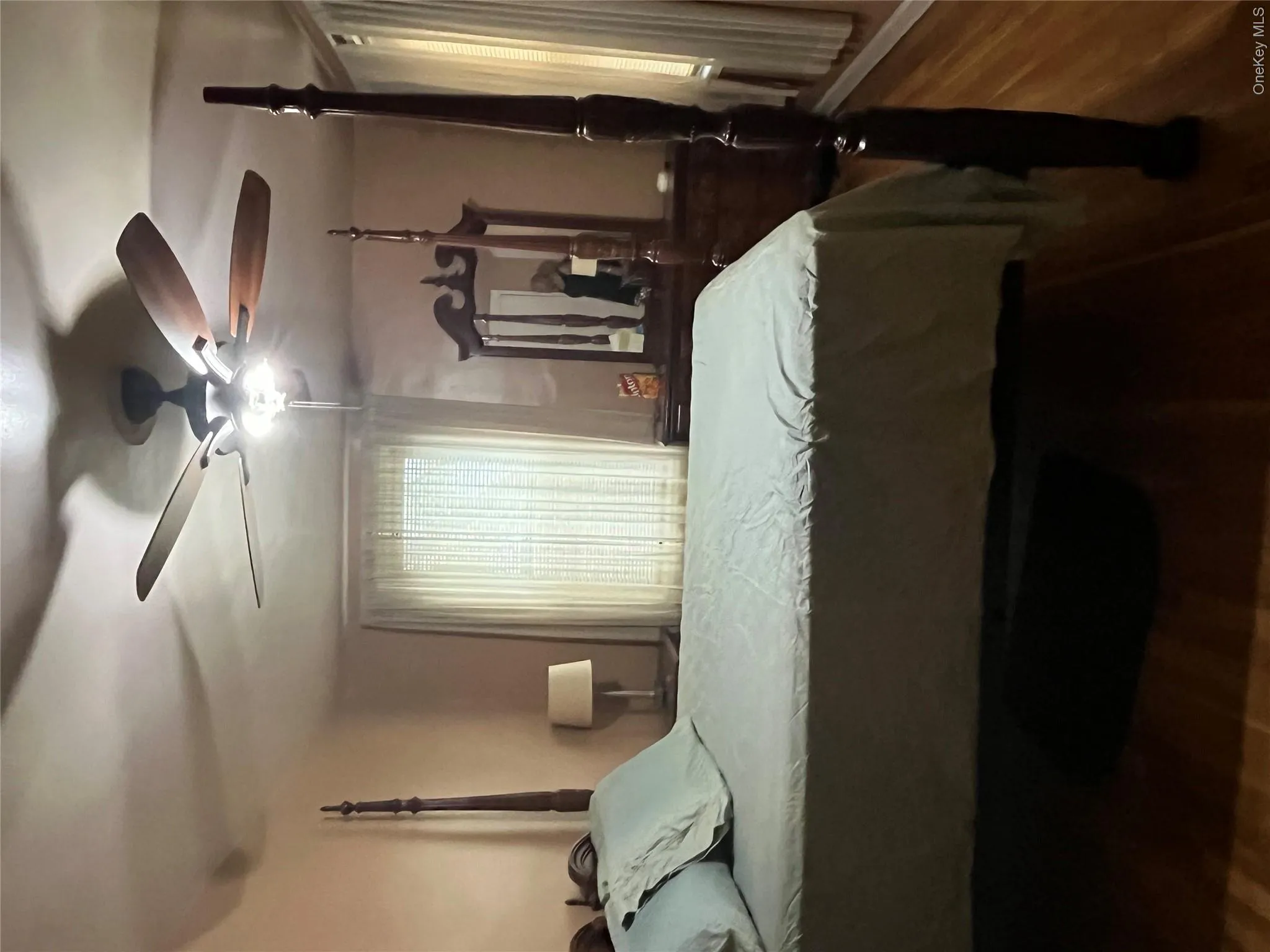 Bedroom with ceiling fan and hardwood / wood-style flooring Bedroom with ceiling fan and hardwood / wood-style flooring