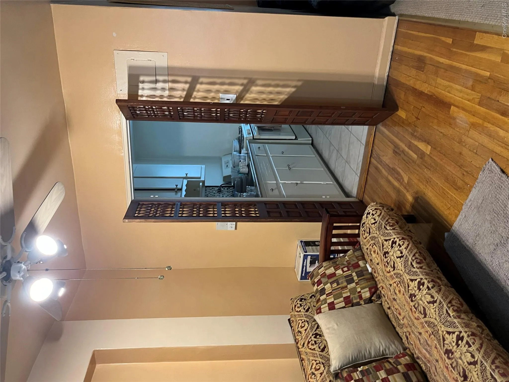 Living room featuring light hardwood / wood-style floors, sink, and ceiling fan Living room featuring light hardwood / wood-style floors, sink, and ceiling fan