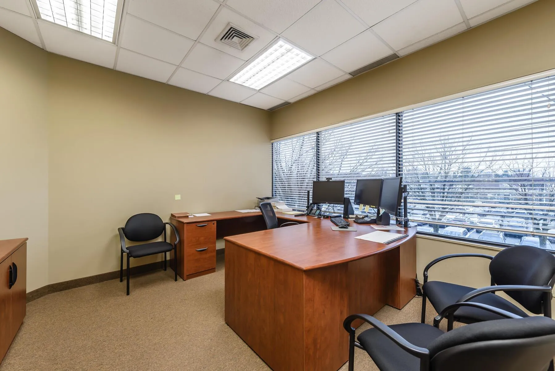 Carpeted office space with a paneled ceiling Carpeted office space with a paneled ceiling
