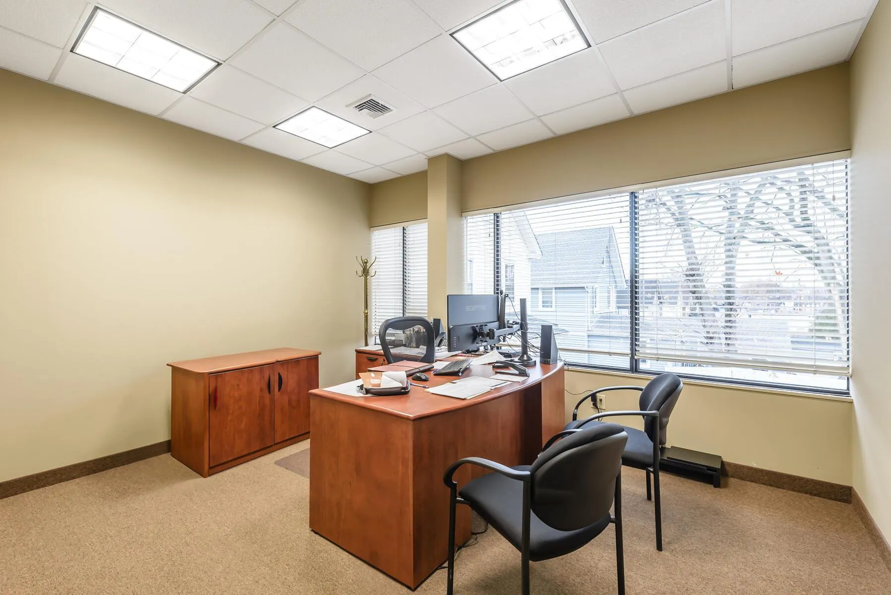 Office featuring light carpet and a drop ceiling Office featuring light carpet and a drop ceiling