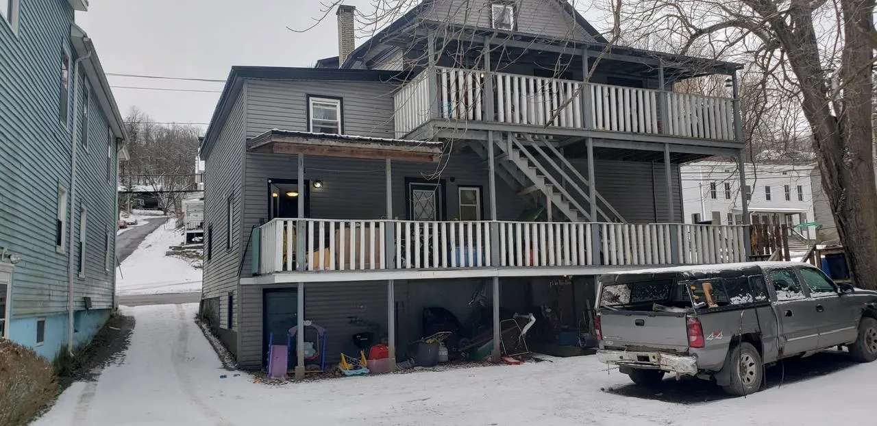 Snow covered property featuring a balcony Snow covered property featuring a balcony