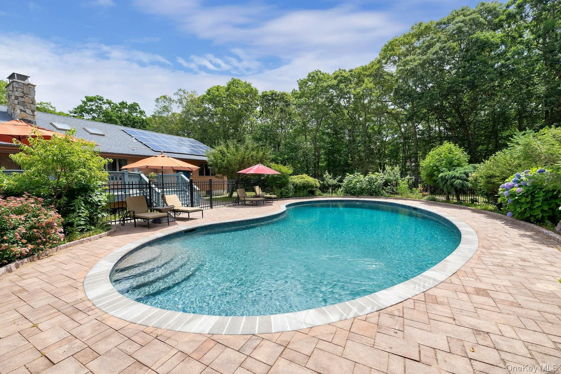 Outdoor pool with a patio Outdoor pool with a patio