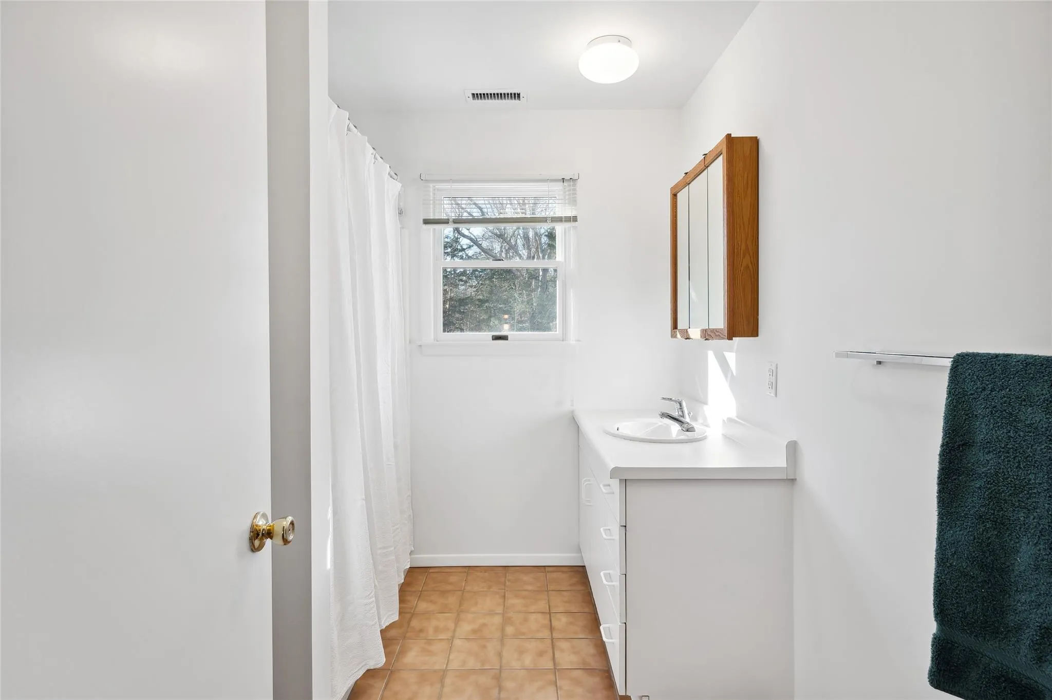 Bathroom with vanity and tile patterned flooring Bathroom with vanity and tile patterned flooring