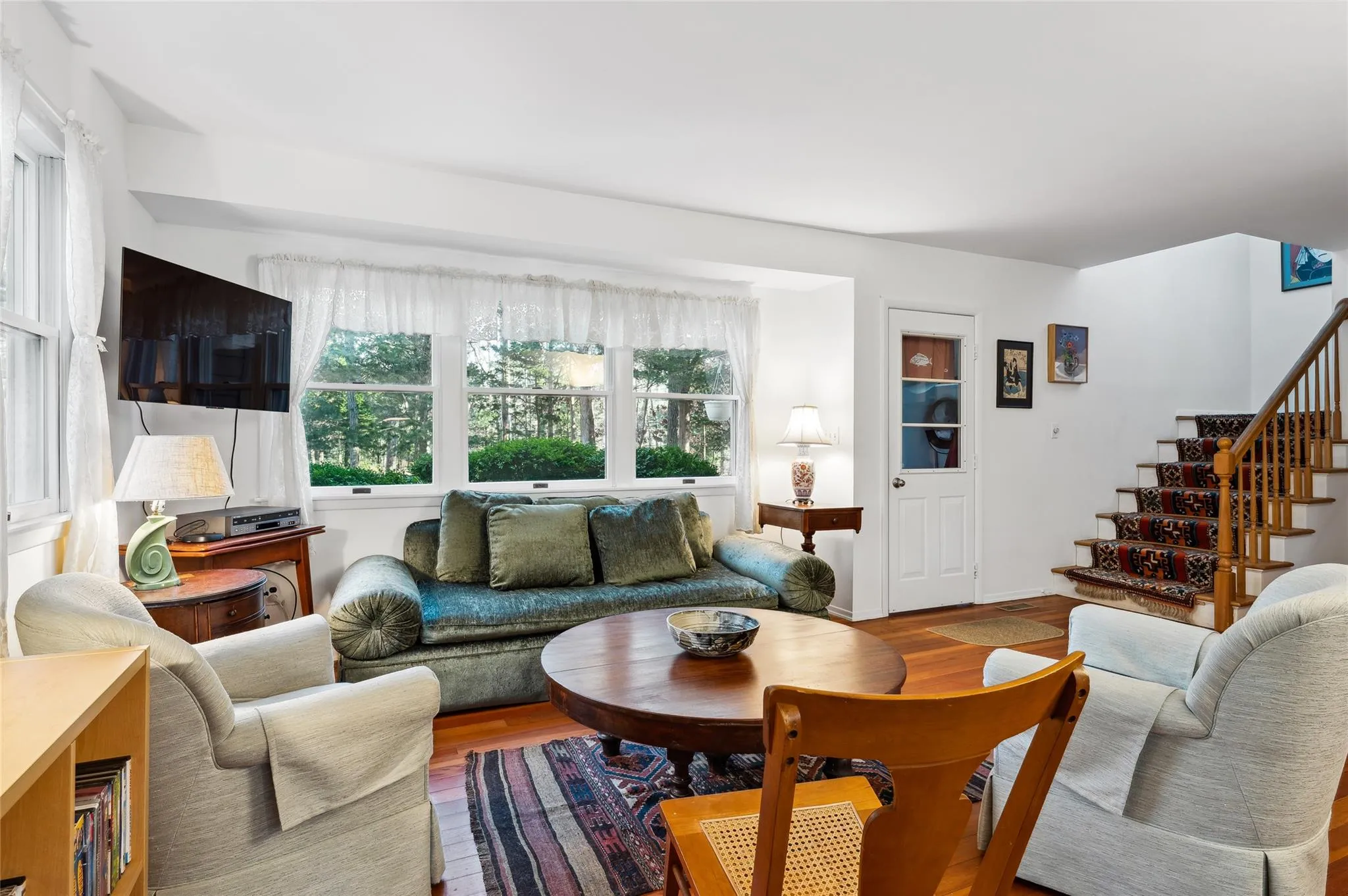 Living room featuring hardwood / wood-style flooring Living room featuring hardwood / wood-style flooring