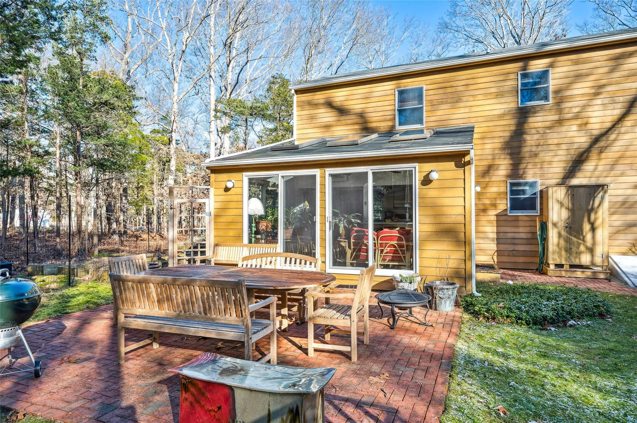 Back of property featuring a sunroom and a patio Back of property featuring a sunroom and a patio