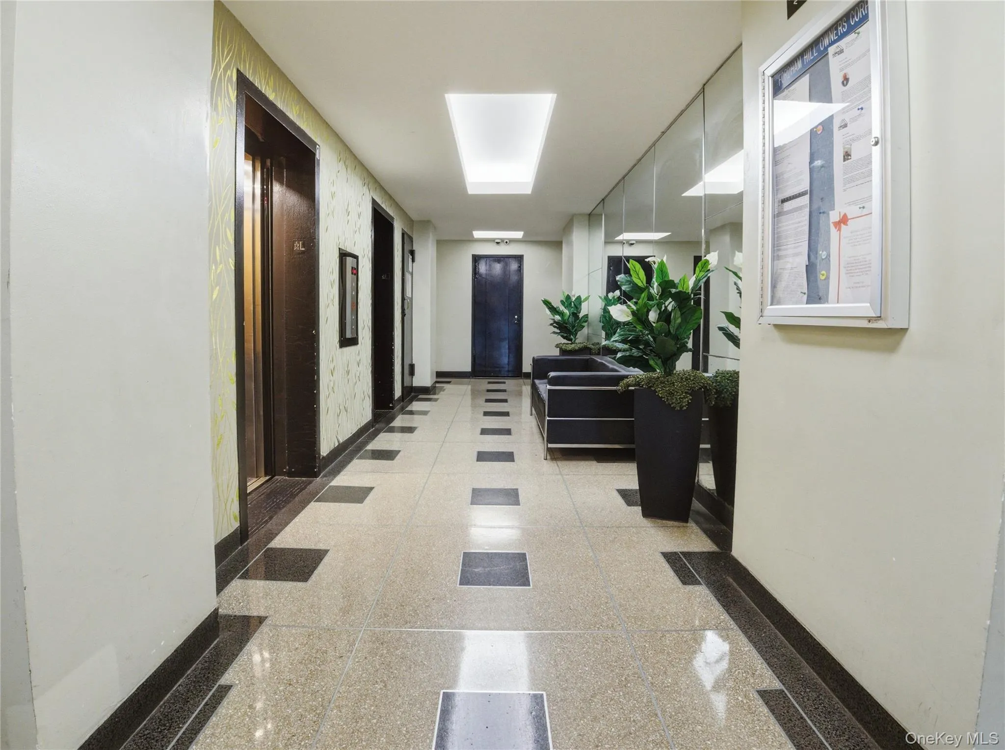 Hallway with baseboards and elevator Hallway with baseboards and elevator