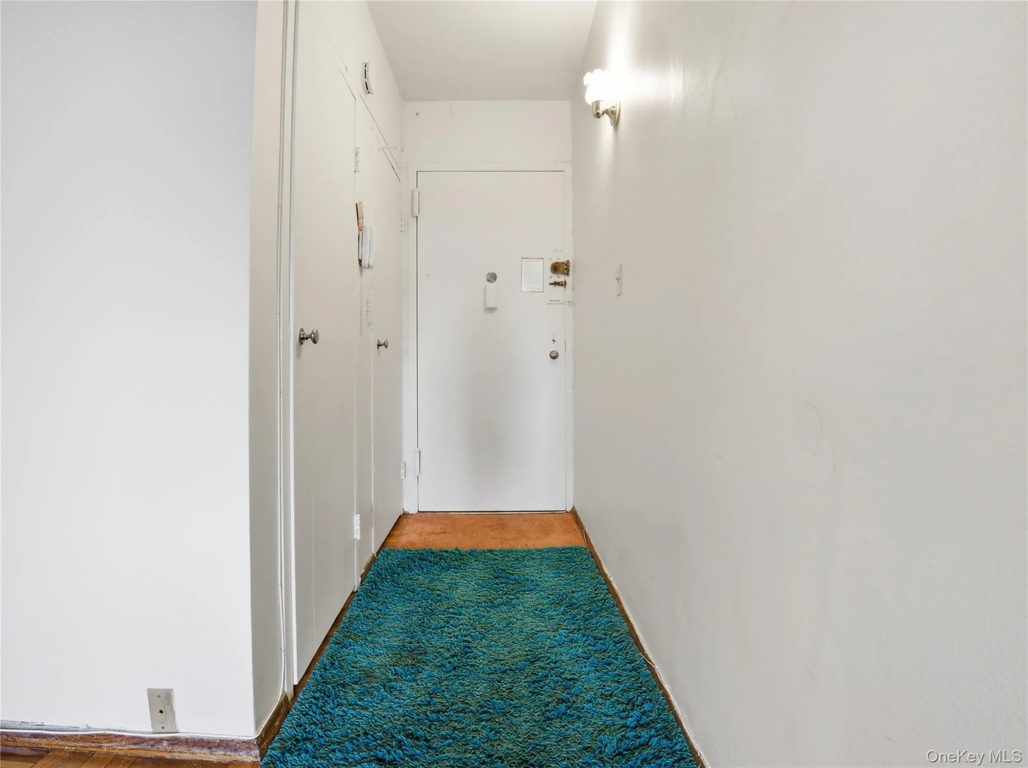 Hallway with carpet flooring Hallway with carpet flooring