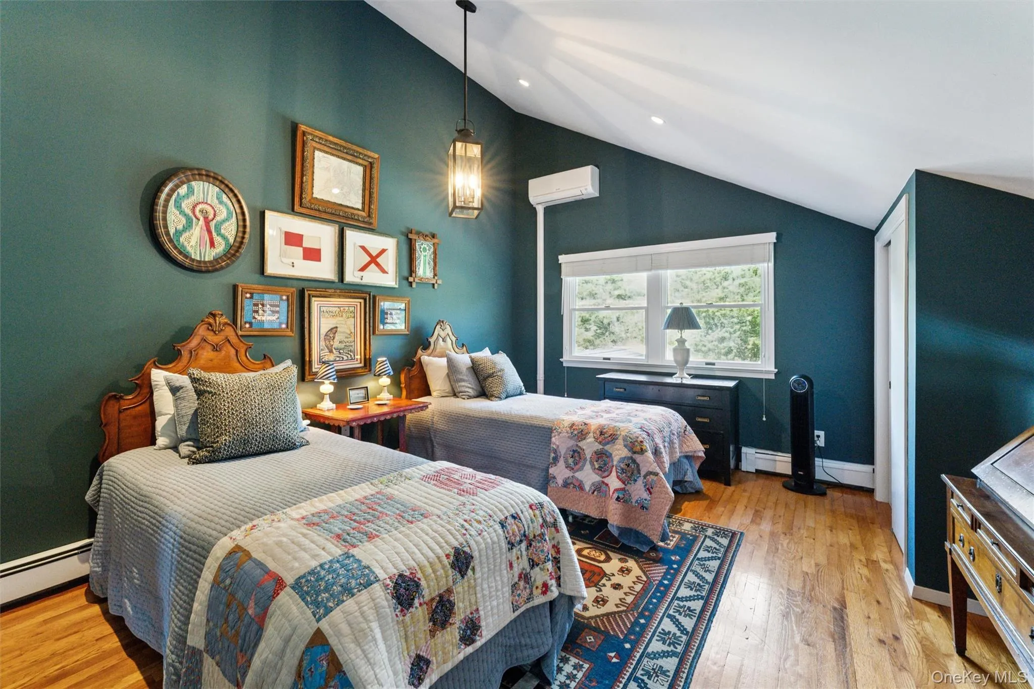 Bedroom with light wood-style flooring, high vaulted ceiling, a wall unit AC, a baseboard heating unit, and recessed lighting Bedroom with light wood-style flooring, high vaulted ceiling, a wall unit AC, a baseboard heating unit, and recessed lighting