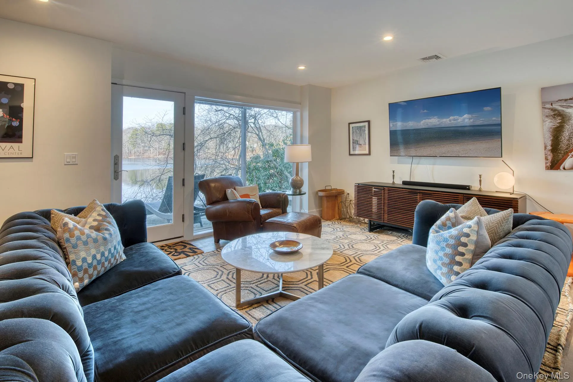 Living room with visible vents and recessed lighting Living room with visible vents and recessed lighting