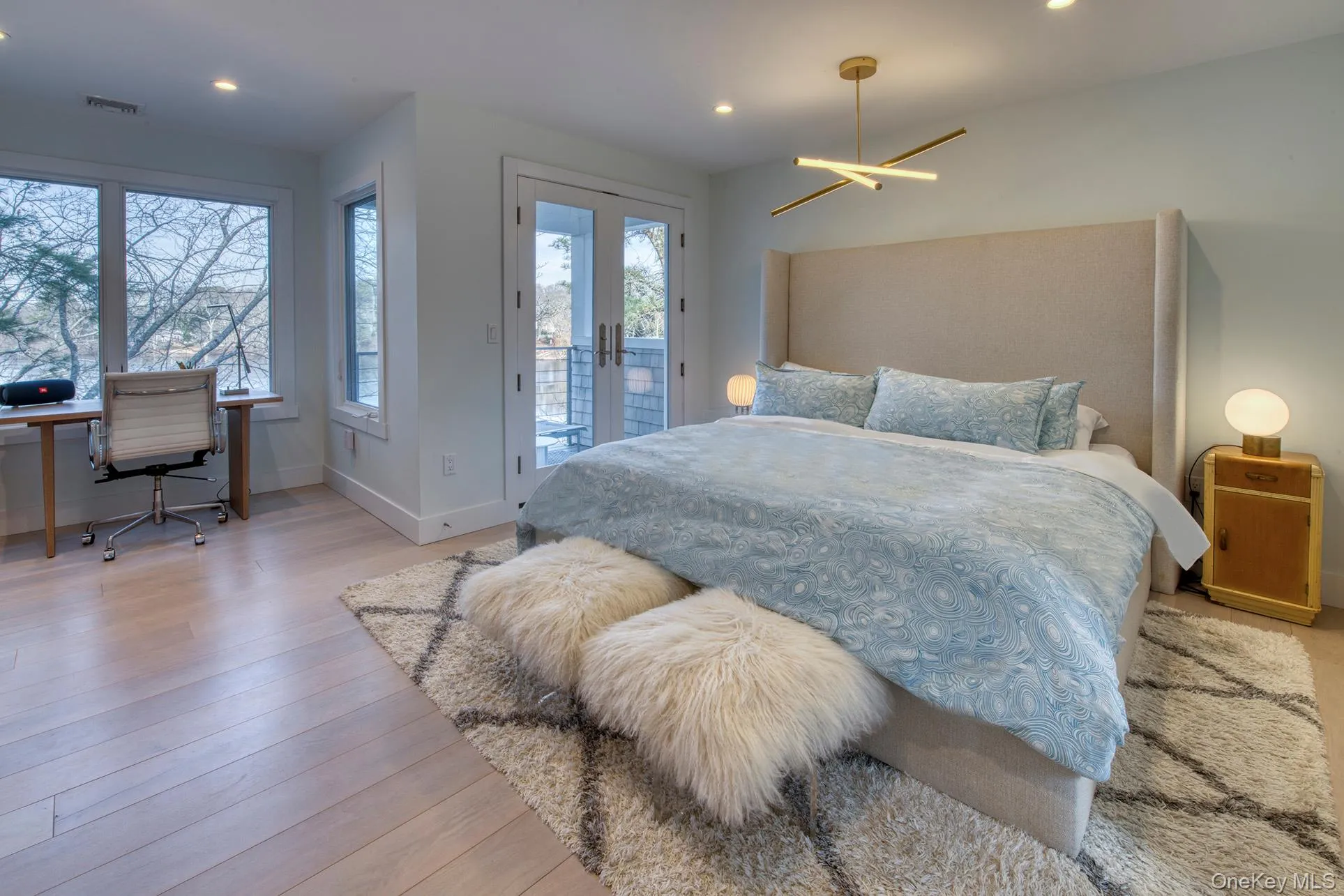 Bedroom featuring access to exterior, french doors, visible vents, light wood-style floors, and baseboards Bedroom featuring access to exterior, french doors, visible vents, light wood-style floors, and baseboards